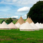 bell-tent-village-by-river